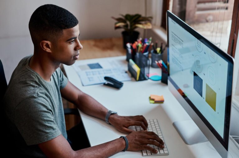 Business owner comparing quotes before deciding to hire a web designer in Kenya