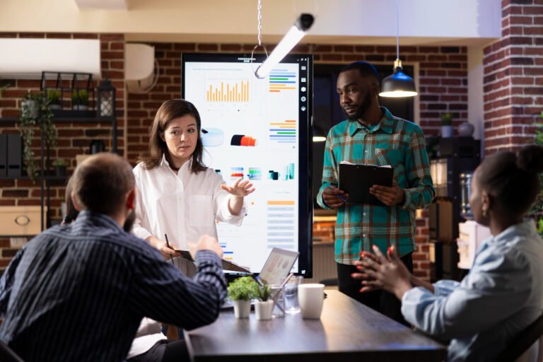 Marketing team reviewing a falling chart after traffic dropped after redesign