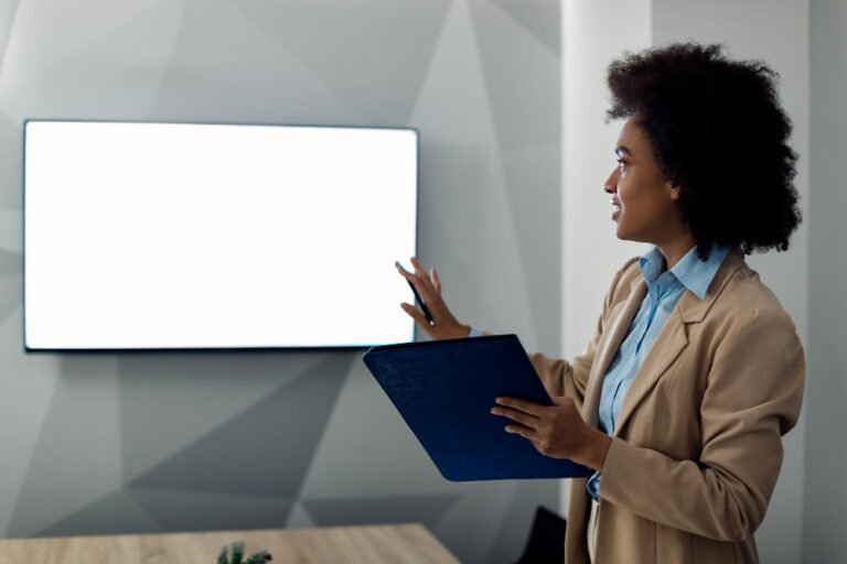 Laptop showing three clearly structured coaching packages online with visible prices