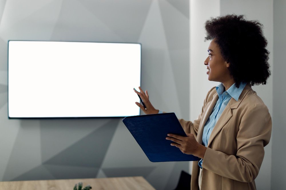 Laptop showing three clearly structured coaching packages online with visible prices