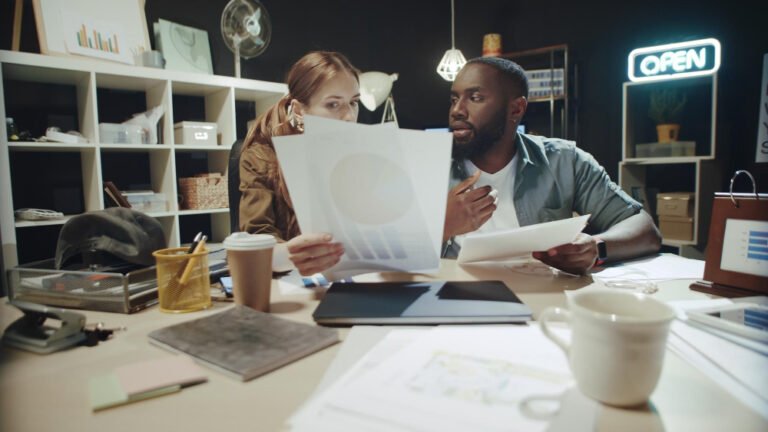A business owner reviewing a printed quote while comparing website cost in Kenya