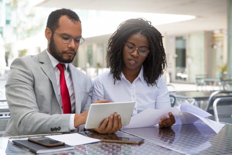Owner and bookkeeper reviewing website figures together using Google Search Console for business owners