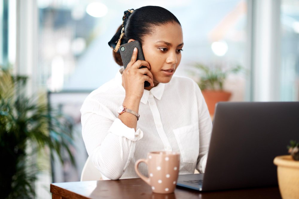 Sales assistant on a long phone call while another enquiry waits