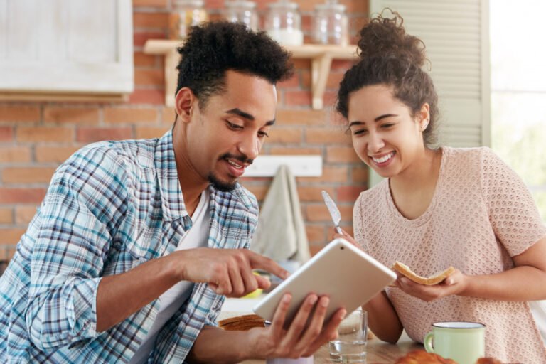 Couple and a planner reviewing dates together, the first test of any event planner website Kenya