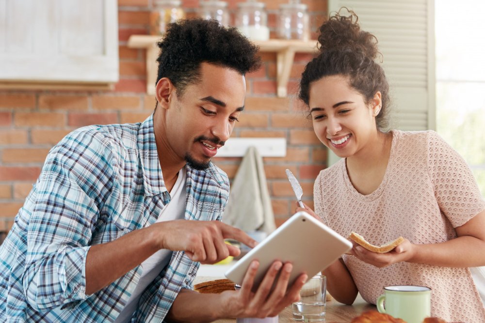 Couple and a planner reviewing dates together, the first test of any event planner website Kenya